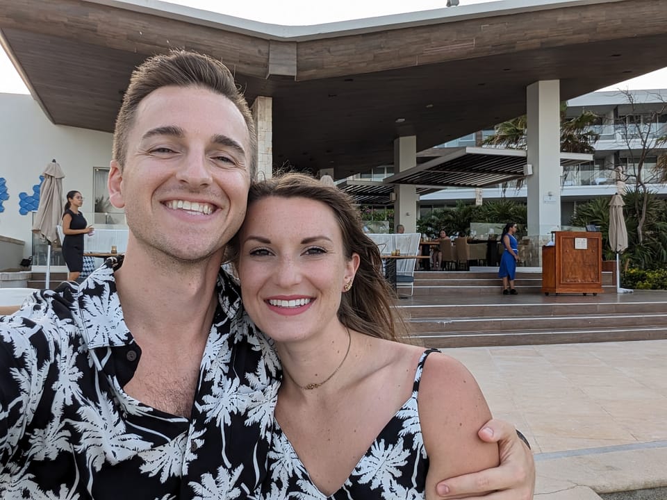 Tony and Emily in matching black and white tropical outfits